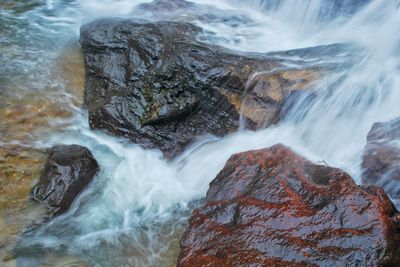 Close-up of waterfall against sea