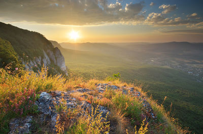 Scenic view of landscape against sky during sunset