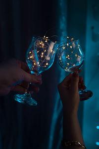 Cropped hand holding wineglass