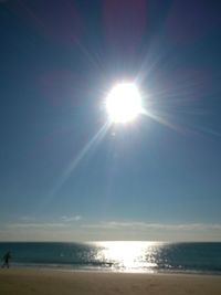 Sun shining over sea