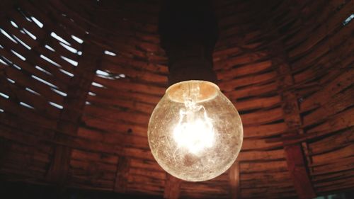 Low angle view of illuminated light bulb