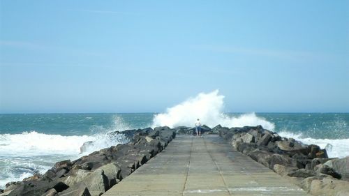 Scenic view of sea against clear blue sky