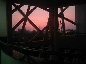 Silhouette bridge against sky during sunset