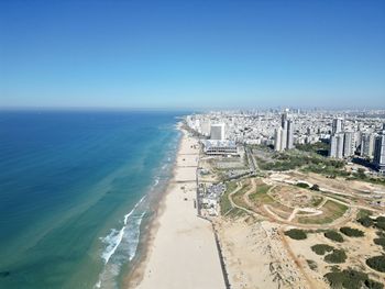 High angle view of sea against clear blue sky