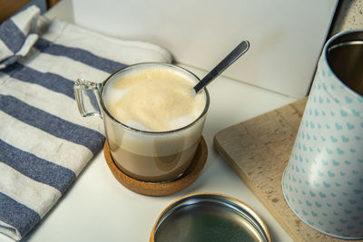 High angle view of coffee cups on table