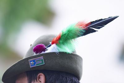 Portrait of person wearing feathers