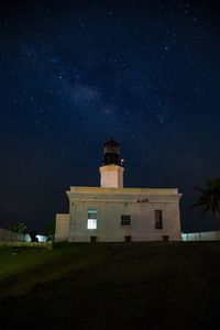 Low angle view of building against star field at night