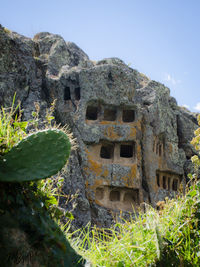 Abandoned built structure on mountain against clear sky