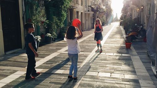 People walking on street in city