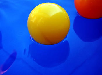 High angle view of yellow ball in swimming pool