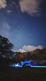 Scenic view of landscape against sky at night