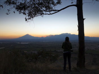 Scenic view of landscape against sky during sunset