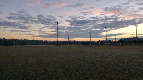 Scenic view of field against sky during sunset