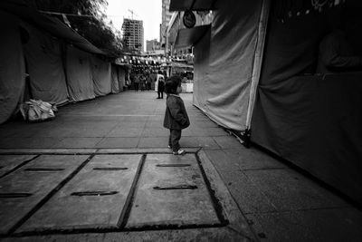 Man walking on street in city