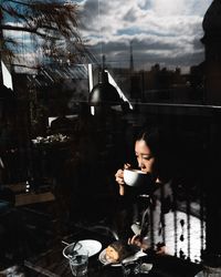Woman holding coffee cup