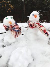 Close-up of christmas decorations on snow