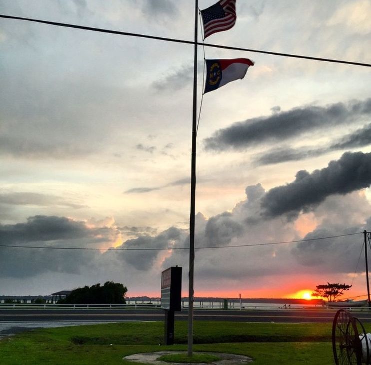 sky, sunset, cloud - sky, cloud, street light, cloudy, road, tranquility, scenics, nature, tranquil scene, field, pole, orange color, transportation, no people, beauty in nature, sunlight, outdoors, sun