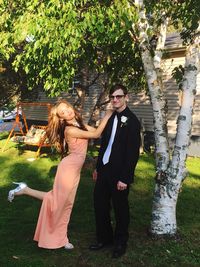 Portrait of young couple posing in back yard