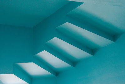 Low angle view of spiral staircase in building