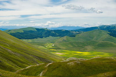 Scenic view of landscape against sky in castelluccio, umbria 