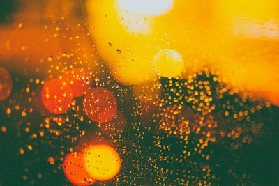 Full frame shot of raindrops on glass