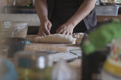 Midsection of man preparing food