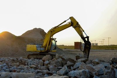 Crane at construction site against clear sky