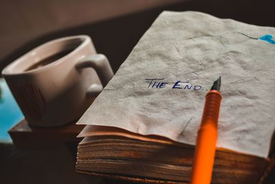 Close-up of pen with text in tissues