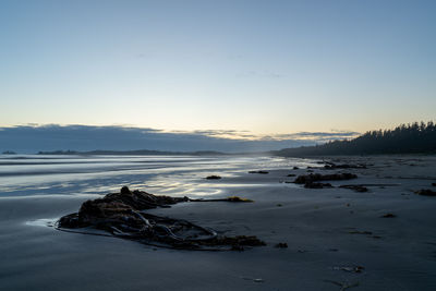 Scenic view of frozen sea against sky during sunset