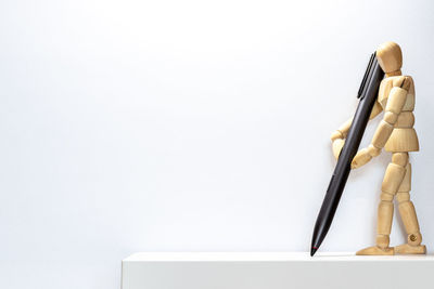 Stack of books on table against white background