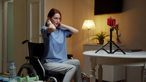 Young woman exercising at home