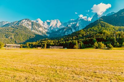 Scenic view of landscape and mountains against sky