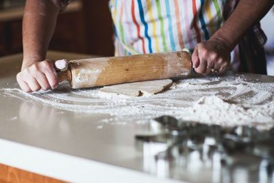 Midsection of person preparing food on table