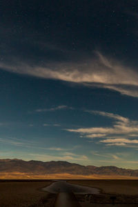 Scenic view of landscape against sky at night
