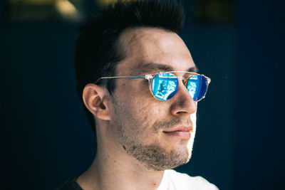 Close-up of man wearing sunglasses outdoors