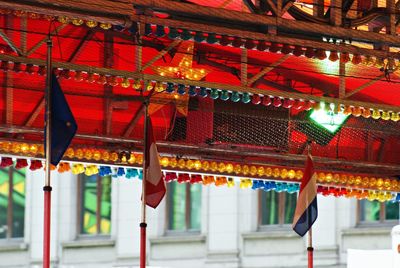 Low angle view of illuminated lanterns hanging on roof