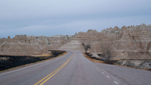 Empty road against sky