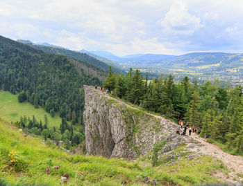 Scenic view of landscape and mountains against sky