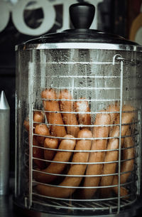 Hot sausages in condensed glass jar