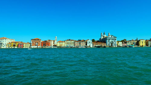 View of buildings against blue sky