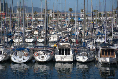 Sailboats moored in the olympic port of barcelona city
