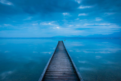 Pier over sea against sky