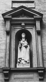 Low angle view of statue against building