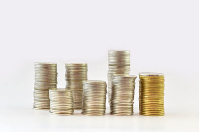 Close-up of coins on white background