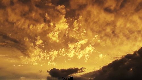 Low angle view of dramatic sky during sunset