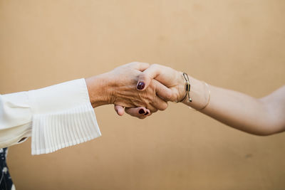 Close-up of business people shaking hands