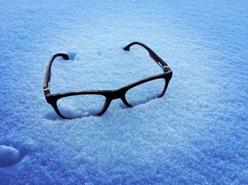 Close-up of bicycle on swimming pool during winter