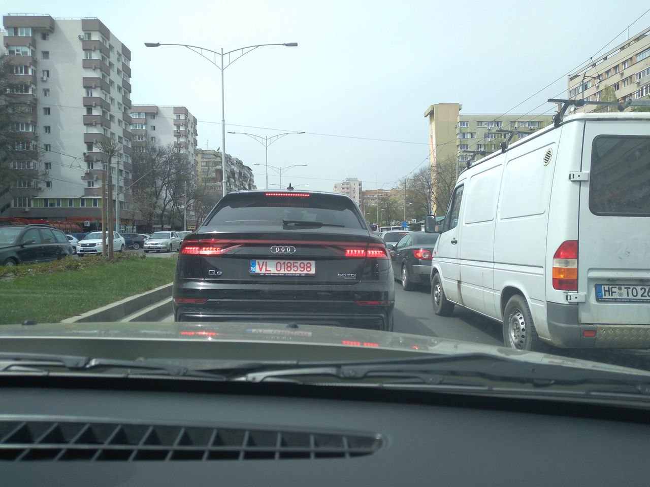 VEHICLES ON ROAD IN CITY