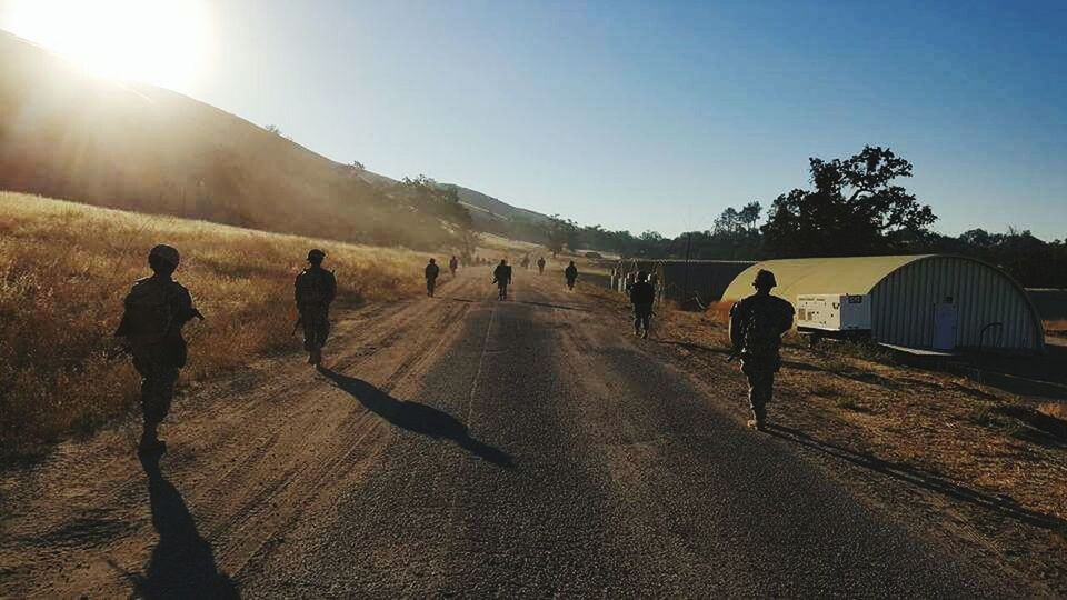 PEOPLE WALKING ON SUNNY DAY