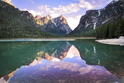 Scenic view of lake and mountains against sky